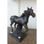 A bronze figure of a horse,
