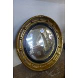 A Regency style gilt convex mirror