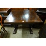 An oak draw-leaf table