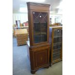 An Edward VII style inlaid mahogany freestanding corner cabinet