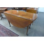 A George II mahogany drop leaf dining table