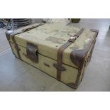 A canvas and leather suitcase