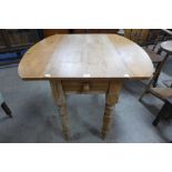 A Victorian pine country drop leaf table