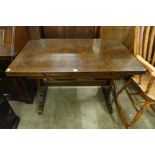 An oak draw-leaf table