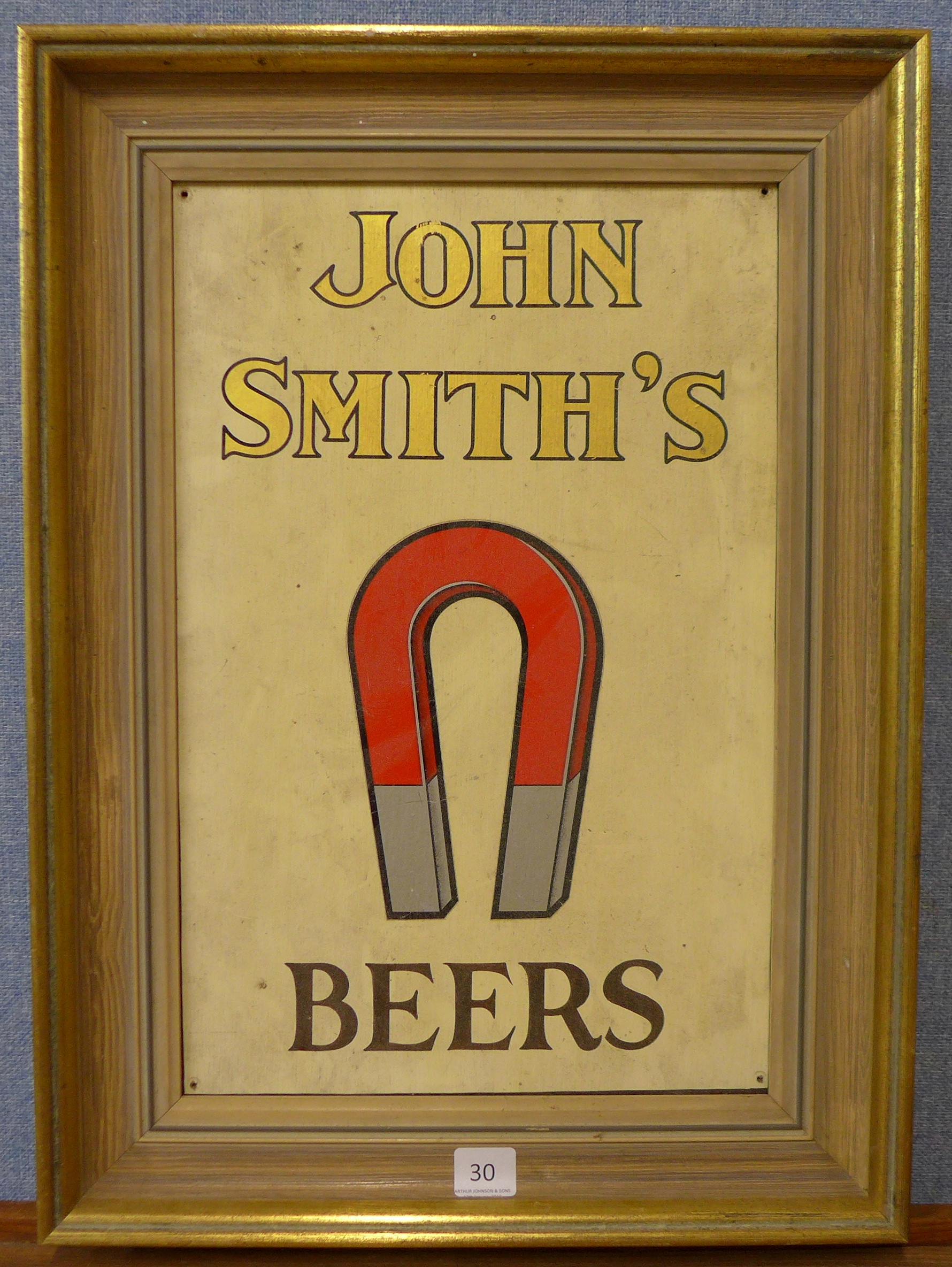 A John Smiths Beers advertising sign