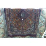 A beige and blue ground rug,