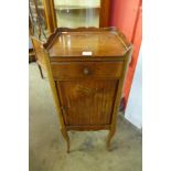 A 19th Century French inlaid mahogany tambour front table de nuit