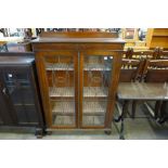 An oak bookcase with glazed leaded lights