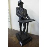 A bronze figure of a jazz player,