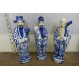 A set of three Chinese blue and white porcelain figures Immortals