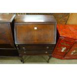 An inlaid mahogany bureau