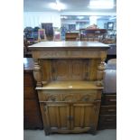 An Old Charm carved oak court cupboard