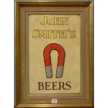 A John Smiths Beers advertising sign