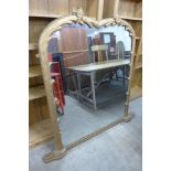 A Victorian gilt overmantel mirror with naturalistic carved frame