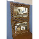 A pair of carved wooden mirrors