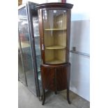 A French mahogany freestanding corner cabinet