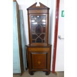 An Edward VII mahogany and marquetry inlaid freestanding corner cabinet