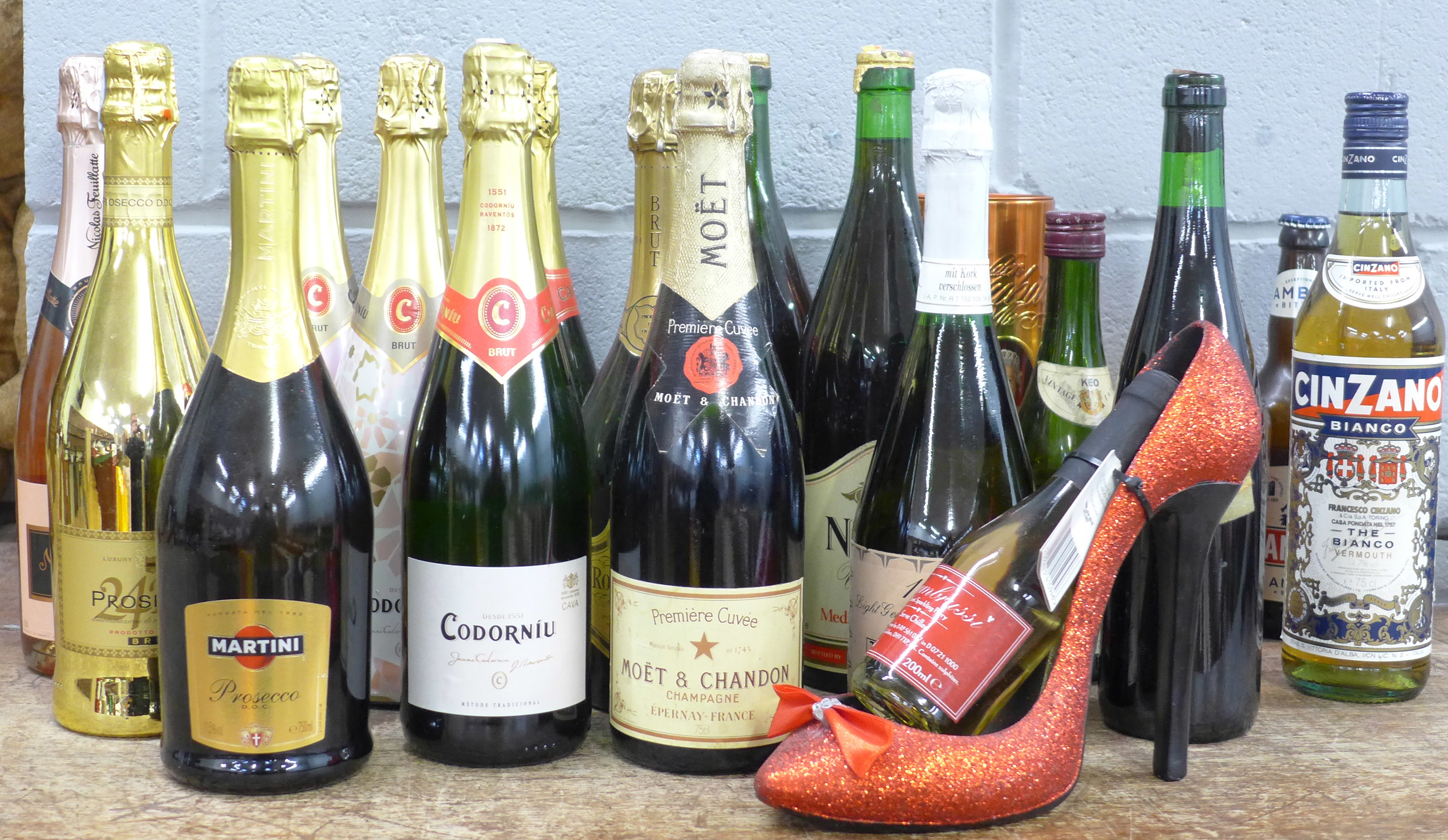 Nineteen bottles of alcohol including sparkling wine and a bottle of Moet & Chandon champagne