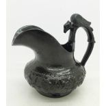 A 19th Century Cyples pottery jug, with bird handle, height 10.