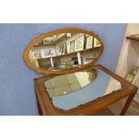 A teak framed mirror and one other