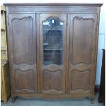 A French oak three door bookcase