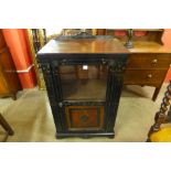 A Victorian Aesthetic Movement walnut and ebonised pier cabinet