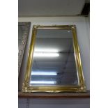 A gilt framed mirror