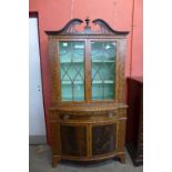 A George III style inlaid mahogany bookcase