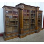 A Victorian Gothic Revival carved oak breakfront bookcase