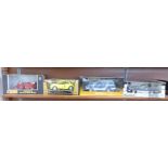 Four 1:18 scale model vehicles, Eagle Collectibles Ford Model T Touring, Burago VW Beetle,