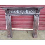 A Victorian carved walnut chimney-piece