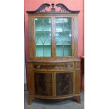 A George III style inlaid mahogany bookcase