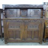 An 18th Century Welsh carved oak cwpwrdd deuddarn