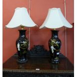 A pair of Chinese black chinoiserie table lamps