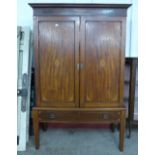 A George III style inlaid mahogany wardrobe