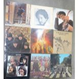 Four The Beatles and five Bob Dylan LP records