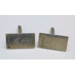 A pair of silver cufflinks,