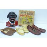 An aluminium cast money box, three pairs of children's shoes and a Muffin the Mule toy,