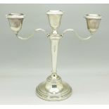 A silver candlestick, Adie Brothers, 20.
