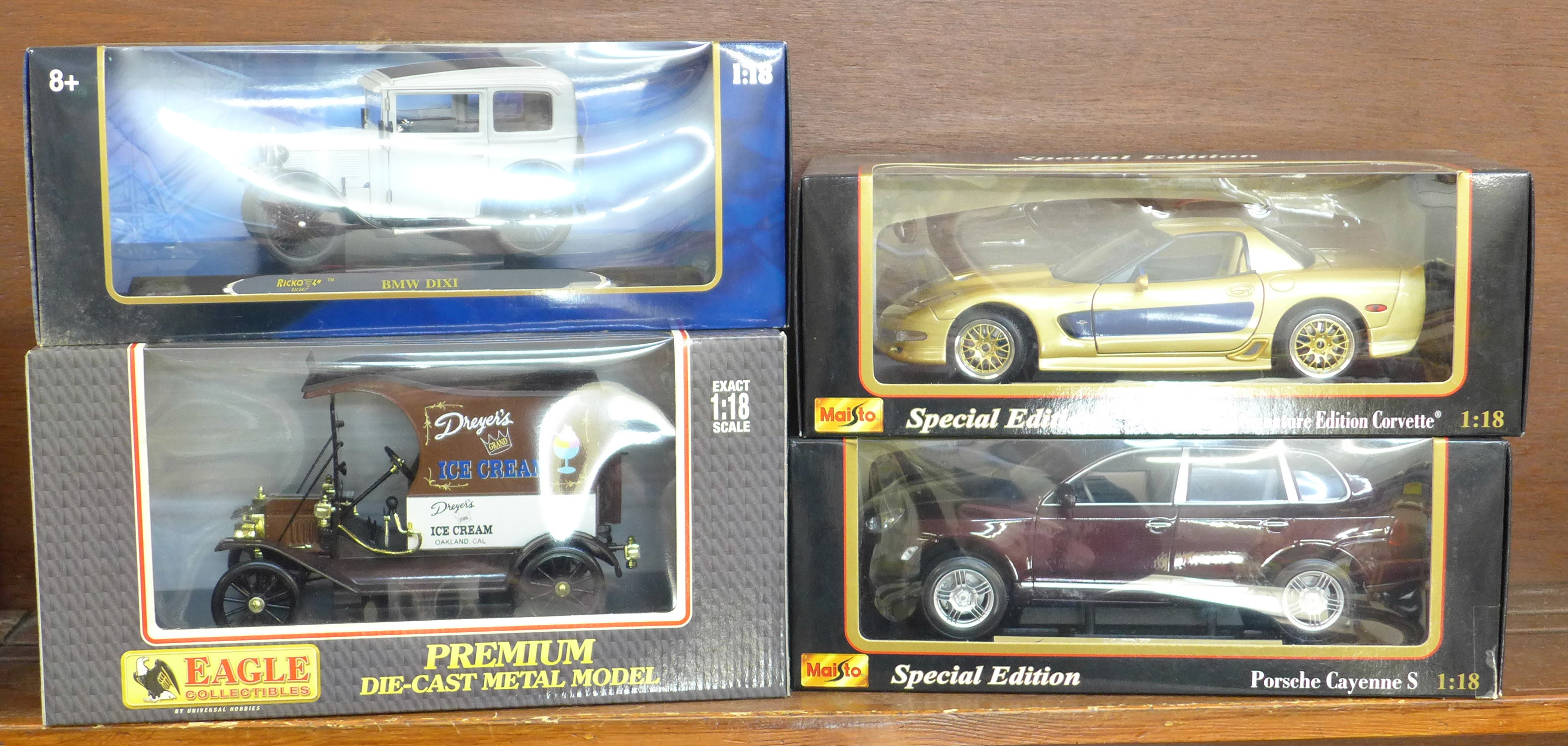 Four 1:18 scale model vehicles; two Maisto and two others, Gulastrand Corvette, Porsche Cayenne S,