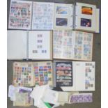 Eight albums of stamps and loose stamps