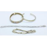 Three silver bracelets and a silver bangle