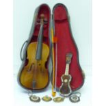 A miniature double bass in a hard case,