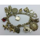 A silver bracelet with silver and other charms