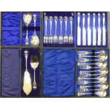 Four matching sets of early 20th Century hammered Arts and Crafts plated cutlery,