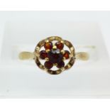 A 9ct gold and garnet ring, 1.