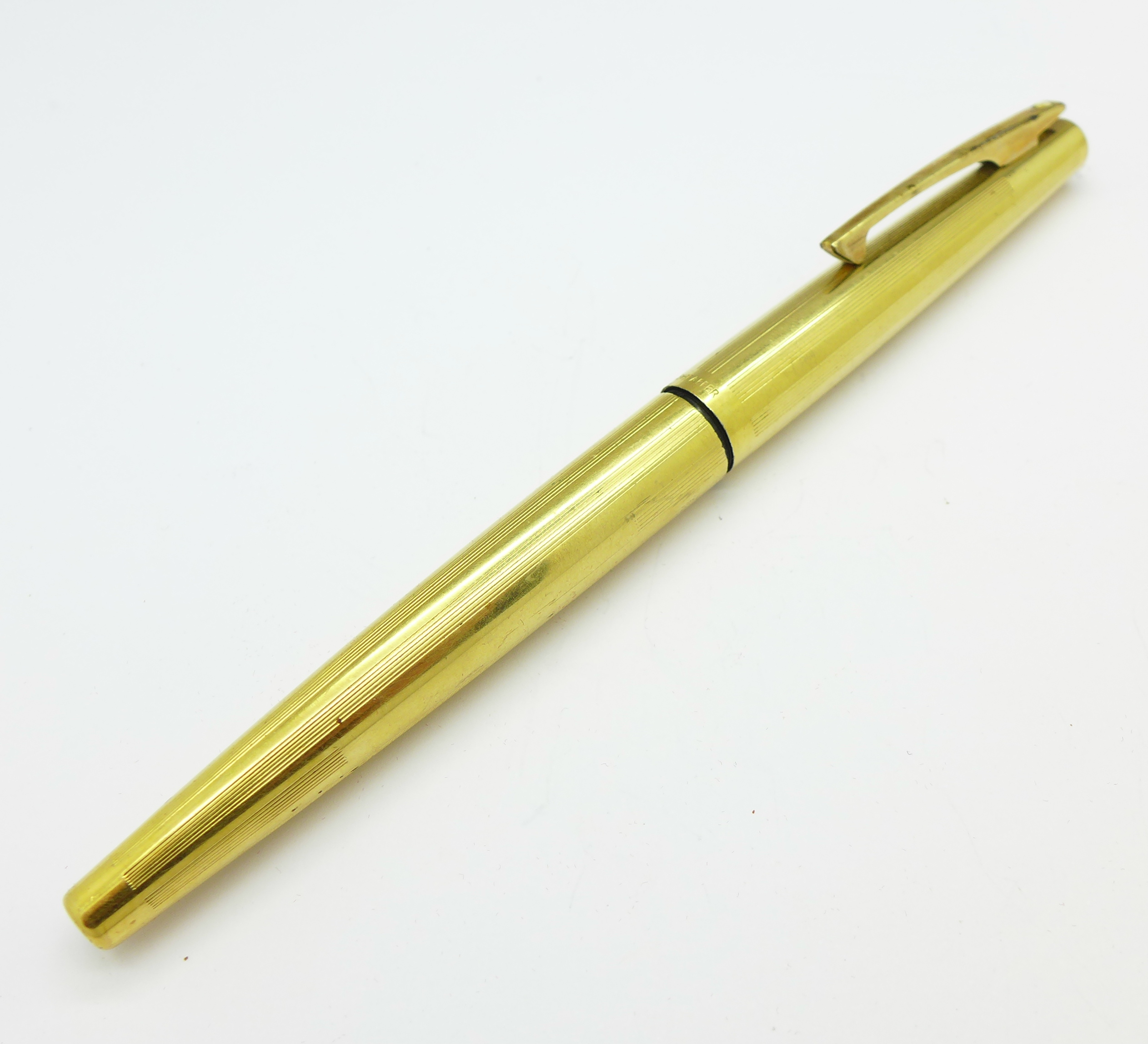 A Sheaffer ink pen with 14k gold nib