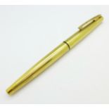 A Sheaffer ink pen with 14k gold nib