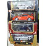 Four 1:18 scale model vehicles; two Maisto, Burago and one other, Porsche Boxster,