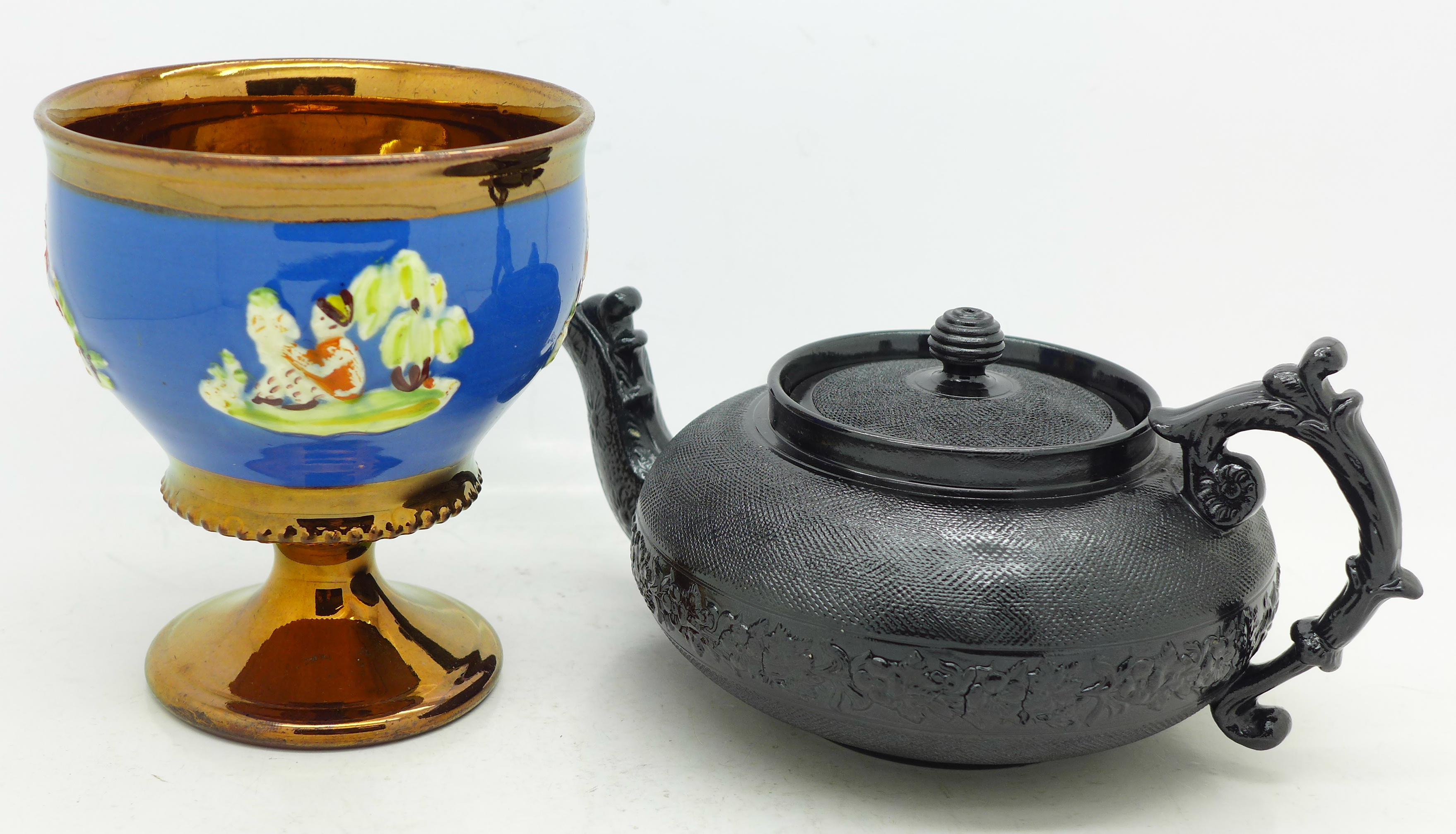 A lustre beaker and a Cyples black teapot,